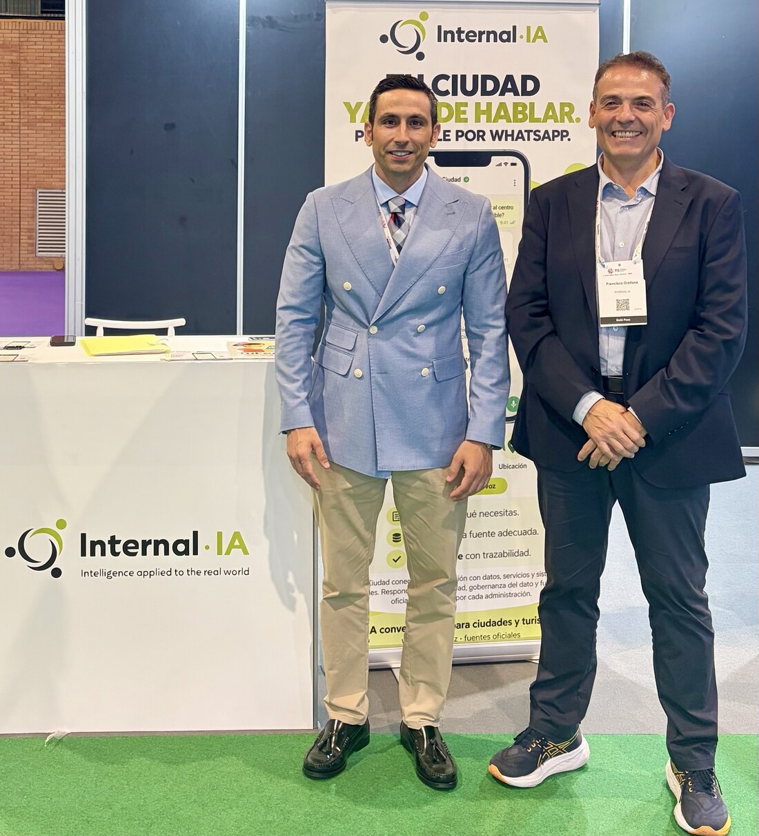 Manuel Lara and Francisco Orellana at the Internal·IA stand, in front of the sign “Your city can now speak”